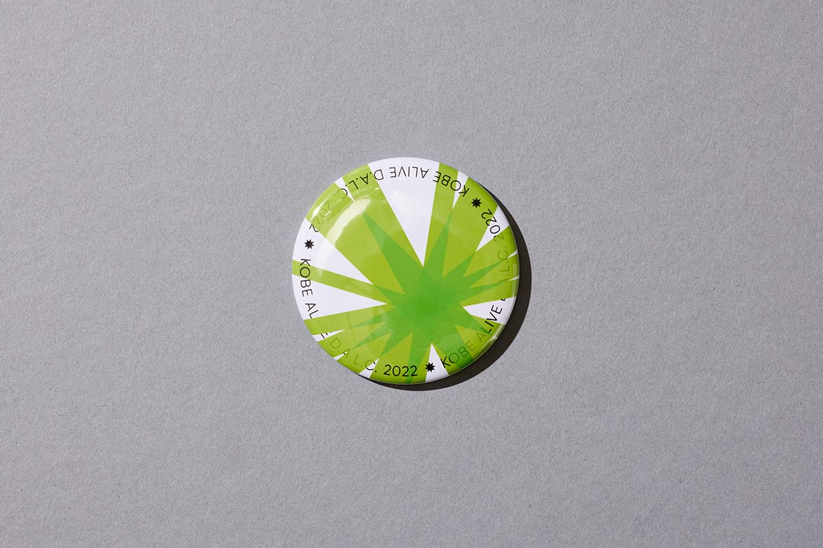 イベントのノベルティ｜緑色の缶バッジ